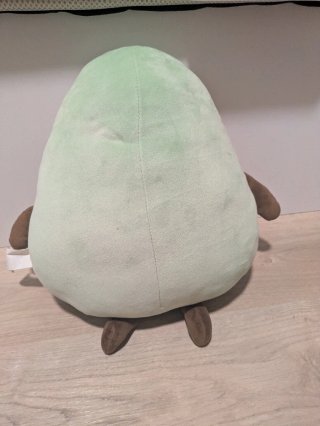 Cojín de aguacate con ojos de corazón