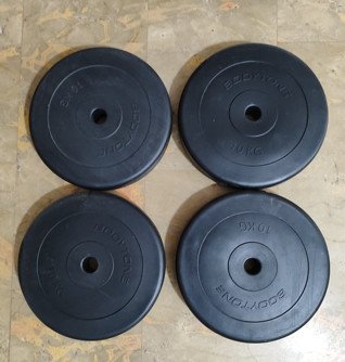 Cuatro discos de Pesas 10 kg Barra 28 mm