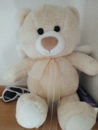 Osito de peluche suave con lazo