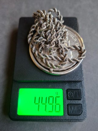 Collana con moneta d'argento