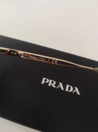 Occhiali da sole Prada neri e oro