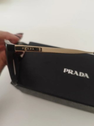 Occhiali da sole Prada neri e oro