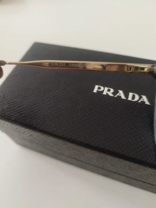 Occhiali da sole Prada neri e oro