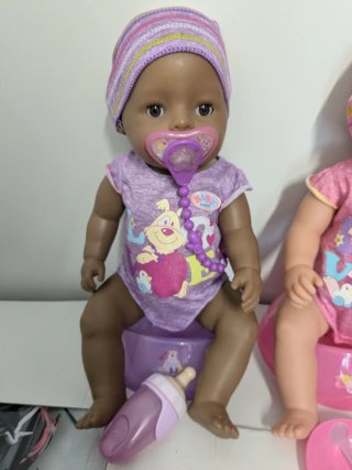 Muñecas Baby Born con orinal y biberón