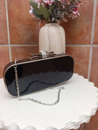 Bolso de fiesta negro con lazo plateado