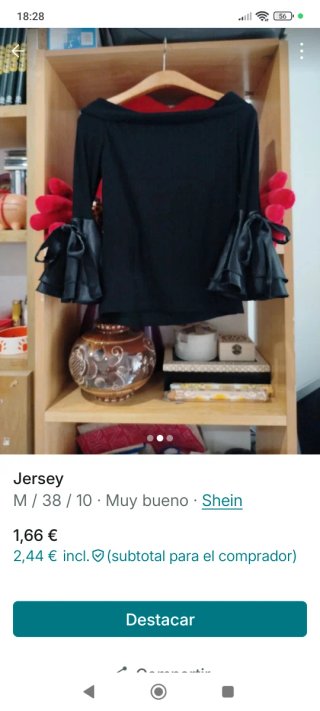 Jersey negro con mangas acampanadas
