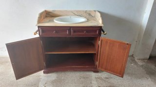 Mueble de lavabo con mármol rosa