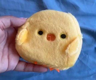 Monedero pollito amarillo.