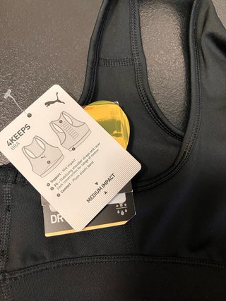 Top deportivo Puma negro