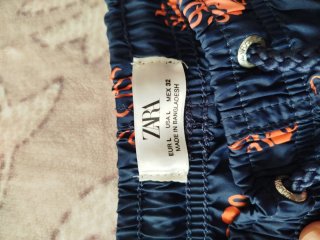 Bañador hombre azul con pulpos naranja
