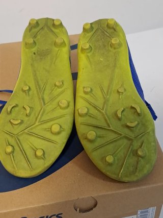 Zapatos de fútbol para niño azul y amarillo
