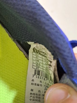 Zapatos de fútbol para niño azul y amarillo