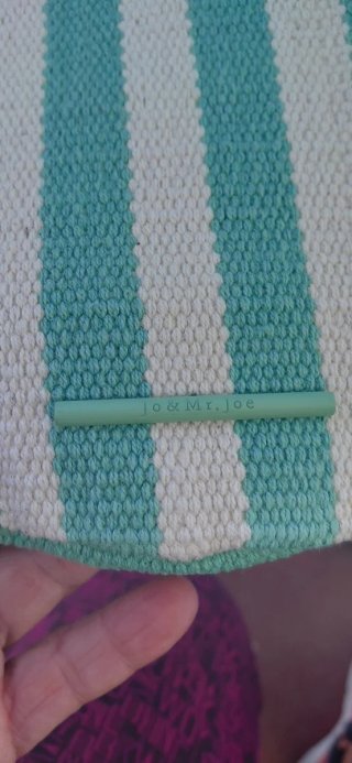 Bolso de rayas verde y morado.De El corte Ingles.
