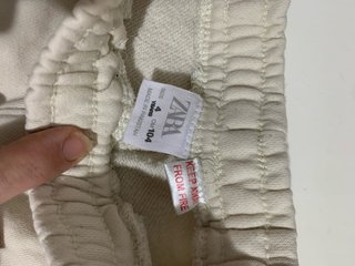 Pantalones beige con logo