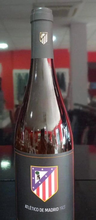 Botella vino y copa Atlético de Madrid