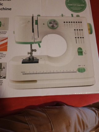 Mini máquina de coser eléctrica gris