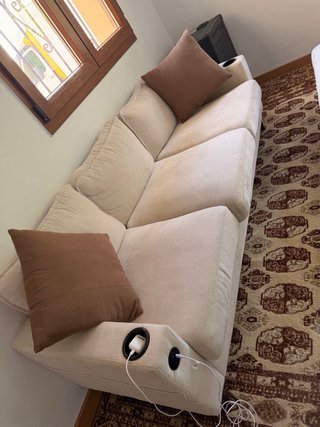 Sofá modular beige con reposapiés