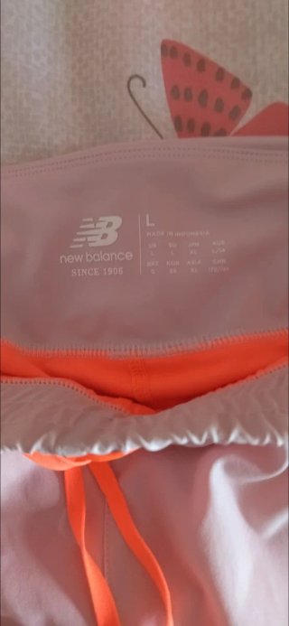 New Balance Shorts Deportivos   Naranja y blanco