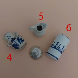 Miniature in ceramica per presepe e case delle bambole da leggere