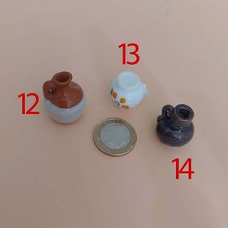 Miniature in ceramica per presepe e case delle bambole da leggere