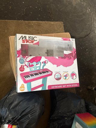 Piano de juguete rosa y azul con micrófono