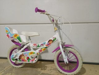 Bicicleta niña de 12", con ruedines de apoyo. Dora