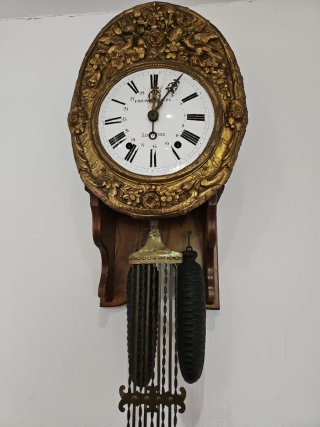 Reloj de péndulo antiguo dorado