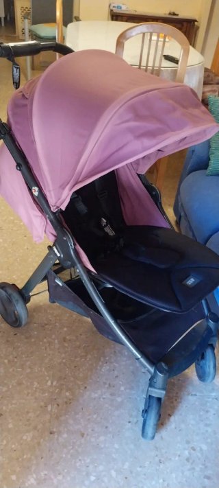 Carrito de bebé rosa y negro