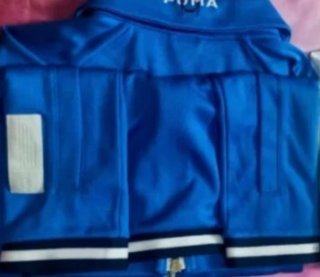 Polo Puma S Azul con Círculo Blanco