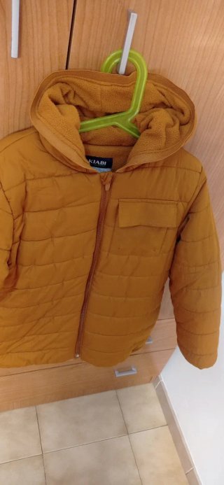 Chaqueta Kiabi color mostaza de talla 10 años