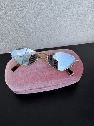 Gafas de sol Miu Miu doradas y marrones