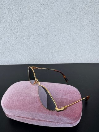 Gafas de sol Miu Miu doradas y marrones