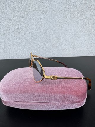 Gafas de sol Miu Miu doradas y marrones