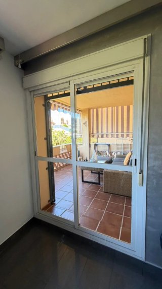 Ventana climalit corredera con persiana y mosquite