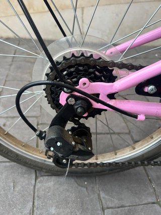 Bicicleta infantil rosa con cesta y asiento muñeca