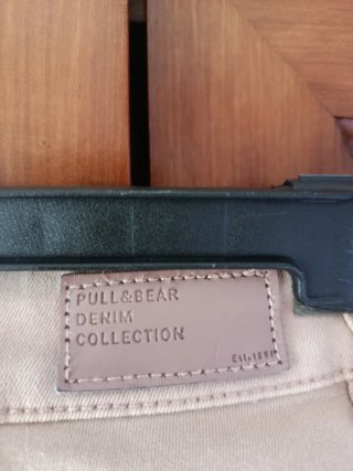 Pantalón pitillo rosa palo con cremalleras