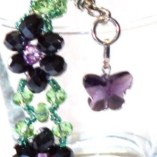 Pulsera de cristales violetas y mariposa