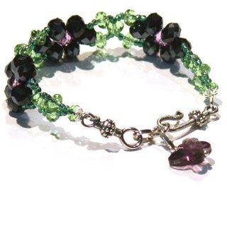 Pulsera de cristales violetas y mariposa