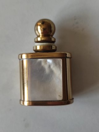 Monedero, medalla y pulsera de monedas