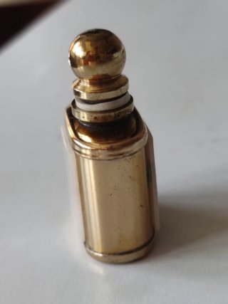 Monedero, medalla y pulsera de monedas