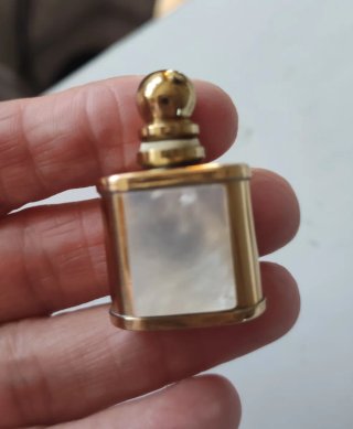 Monedero, medalla y pulsera de monedas