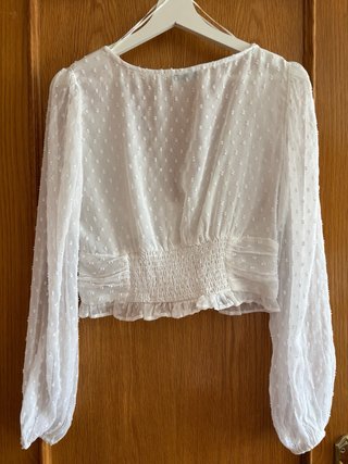 Blusa blanca volantes topos manga larga
