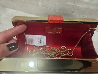 Bolso de mano Purificación García negro y dorado