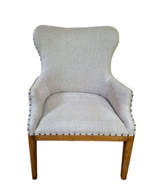 Sillón tapizado beige y madera
