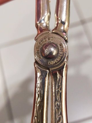 Pinza da portata in metallo argentato