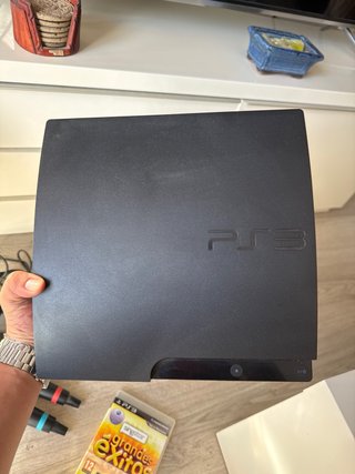 Consola PlayStation 3 con micrófonos y mandos