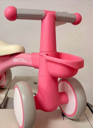 Bicicleta de equilibrio infantil rosa sin pedales