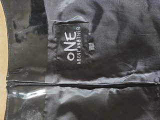 Minifalda efecto piel con ojales y cordones
