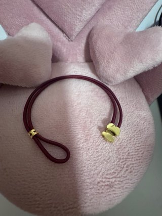 Pulsera Tous granate con osito de oro