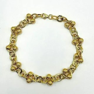 Pulsera dorada con eslabones y cuentas
